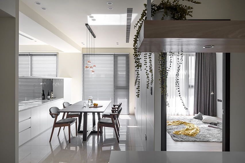 There is a Dining Table and Chairs in the Middle of the Room — TT Shutters & Shading In Ballina, NSW
