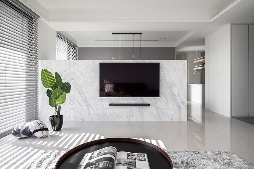 A Living Room With a Flat Screen Tv on the Wall — TT Shutters & Shading In Ballina, NSW