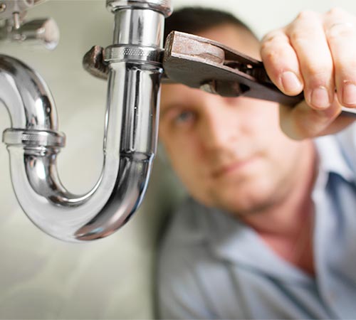 Plumber Fixing a Faucet Spout Pipe — Drain Backups in Shelby Township, MI