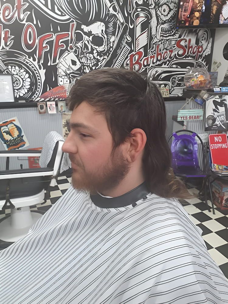 A Man Is Getting His Hair Cut At A Barber Shop — Get It Off Men's Barber Shop In Raymond Terrace, NSW