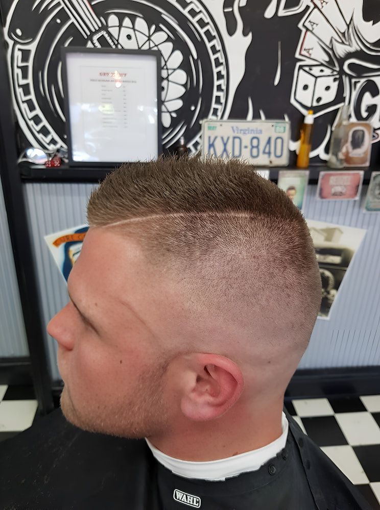 A Man Is Getting His Hair Cut At A Barber Shop — Get It Off Men's Barber Shop In Raymond Terrace, NSW