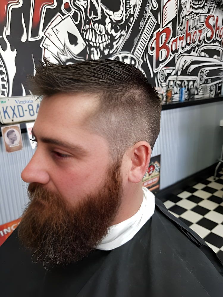 A Man With A Beard Is Getting His Hair Cut At A Barber Shop — Get It Off Men's Barber Shop In Raymond Terrace, NSW