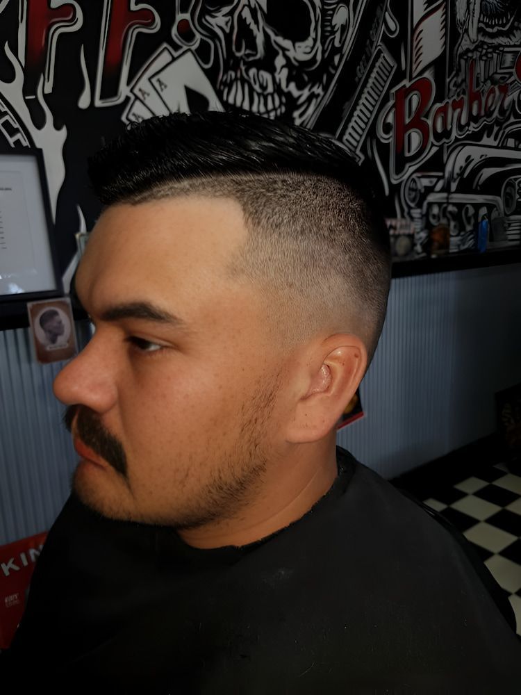 A Man With A Mustache Is Getting His Hair Cut At A Barber Shop — Get It Off Men's Barber Shop In Raymond Terrace, NSW