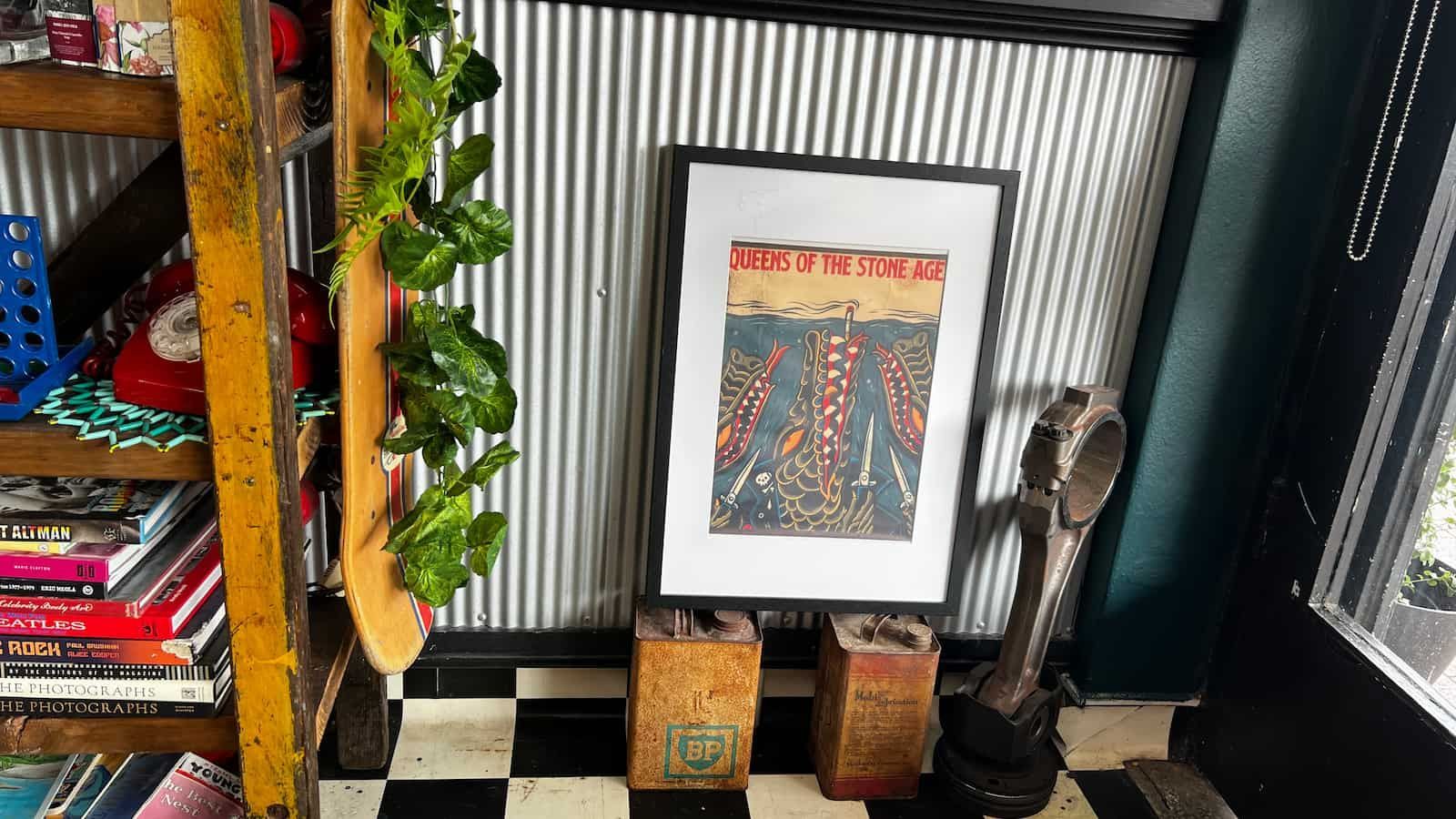 A Room With A Picture On The Wall And A Checkered Floor  Get It Off Men's Barber Shop In Raymond Terrace, NSW