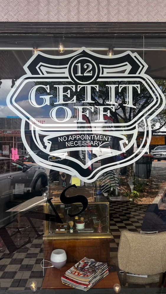 A Store Window With A Logo On It That Says  Get It Off — Get It Off Men's Barber Shop In Raymond Terrace, NSW