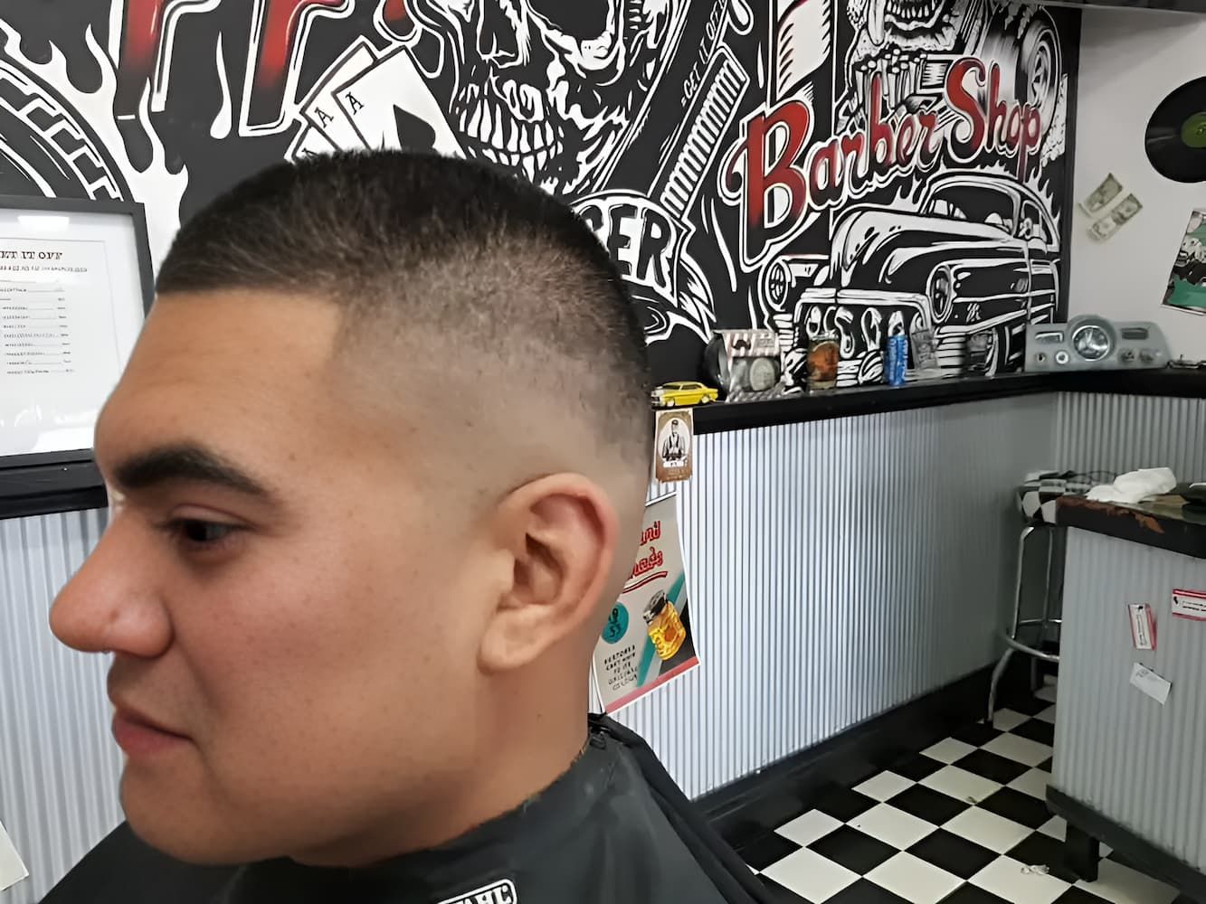 A Man Is Getting His Hair Cut At A Barber Shop — Get It Off Men's Barber Shop In Raymond Terrace, NSW