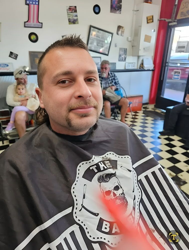 A Man Is Getting His Hair Cut At A Barber Shop — Get It Off Men's Barber Shop In Raymond Terrace, NSW
