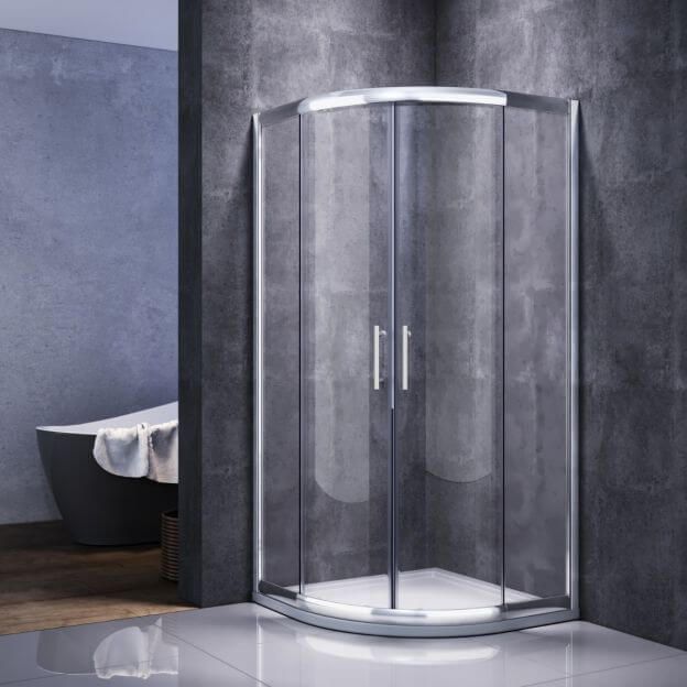 Corner glass shower enclosure in modern bathroom with tub in background.