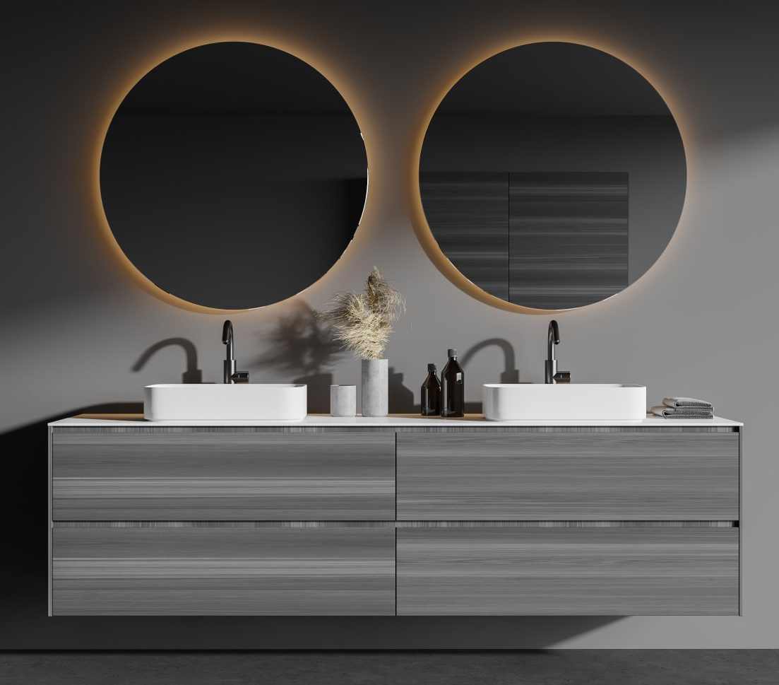 Modern bathroom with gray vanity, two round mirrors with backlights, and white sinks.
