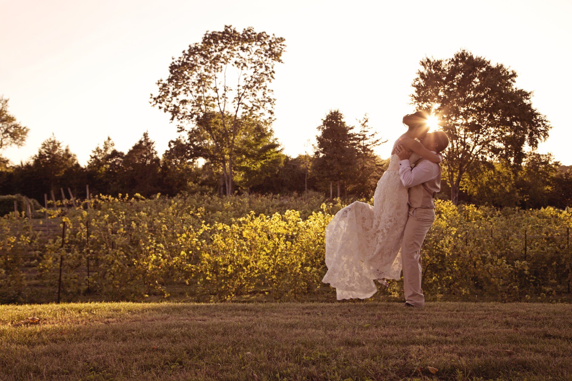 Happy Couple Hugging at Vineyard Wedding