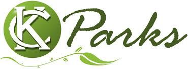 A logo for a company called parks with a green circle and leaves.