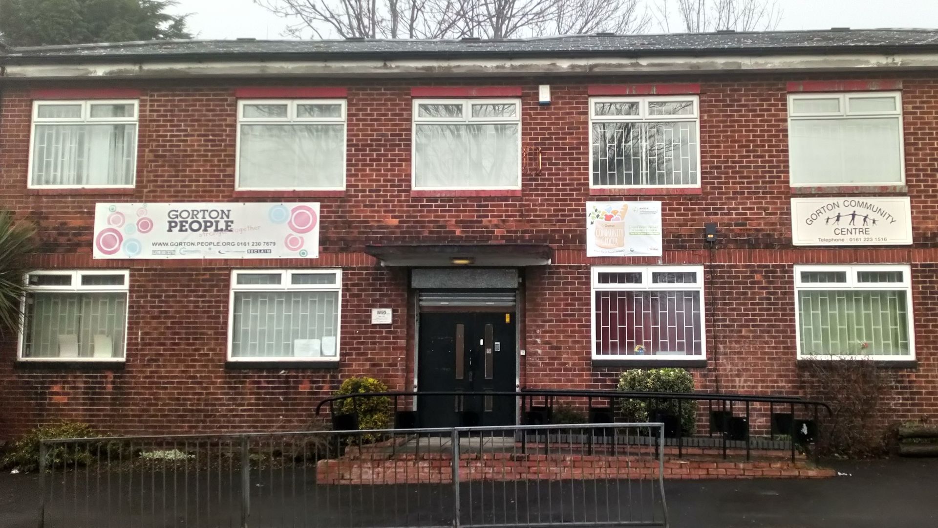 A brick building with a sign that says ' inspire ' on it