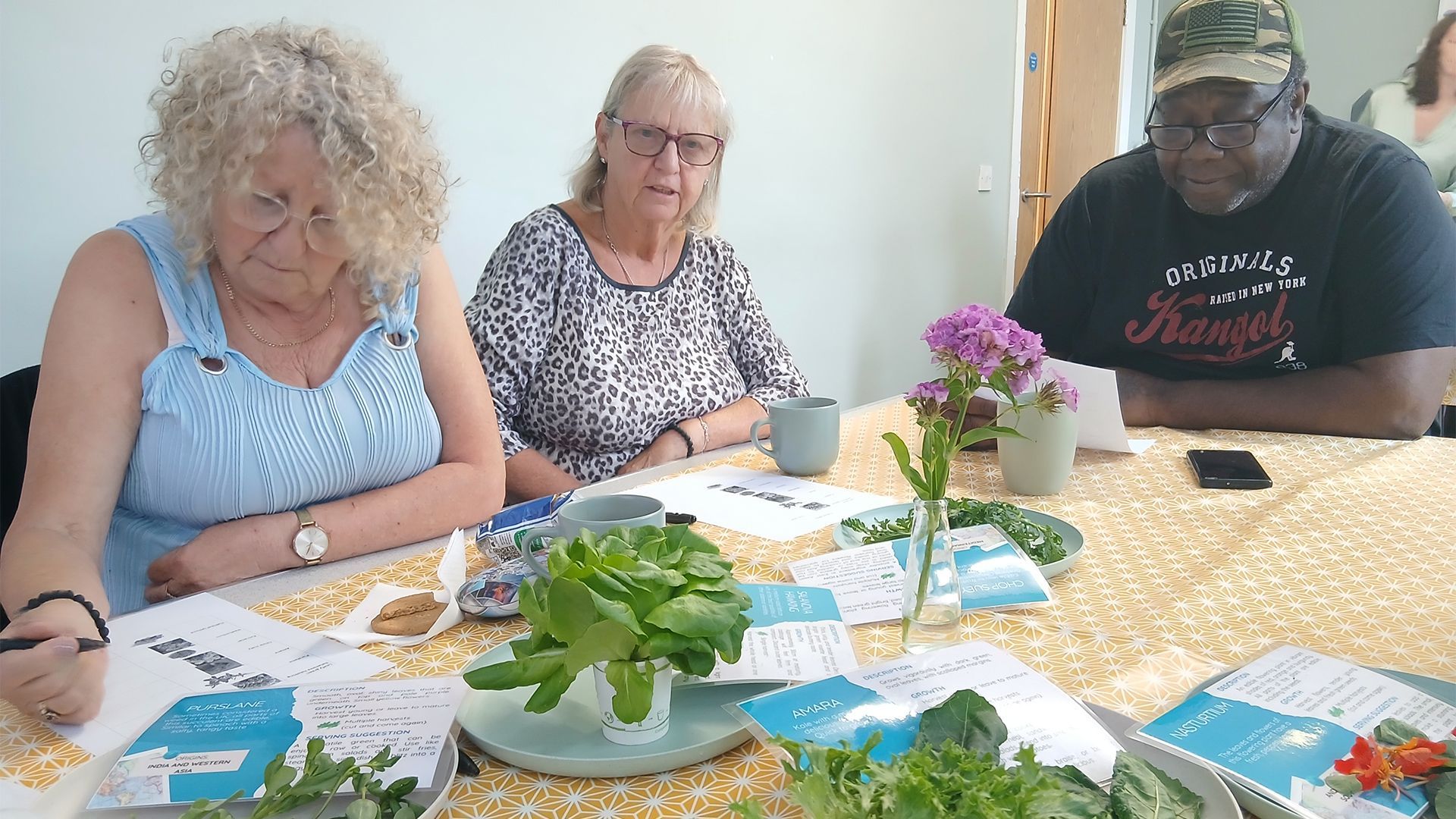 A group of people are doing exercises in a room.