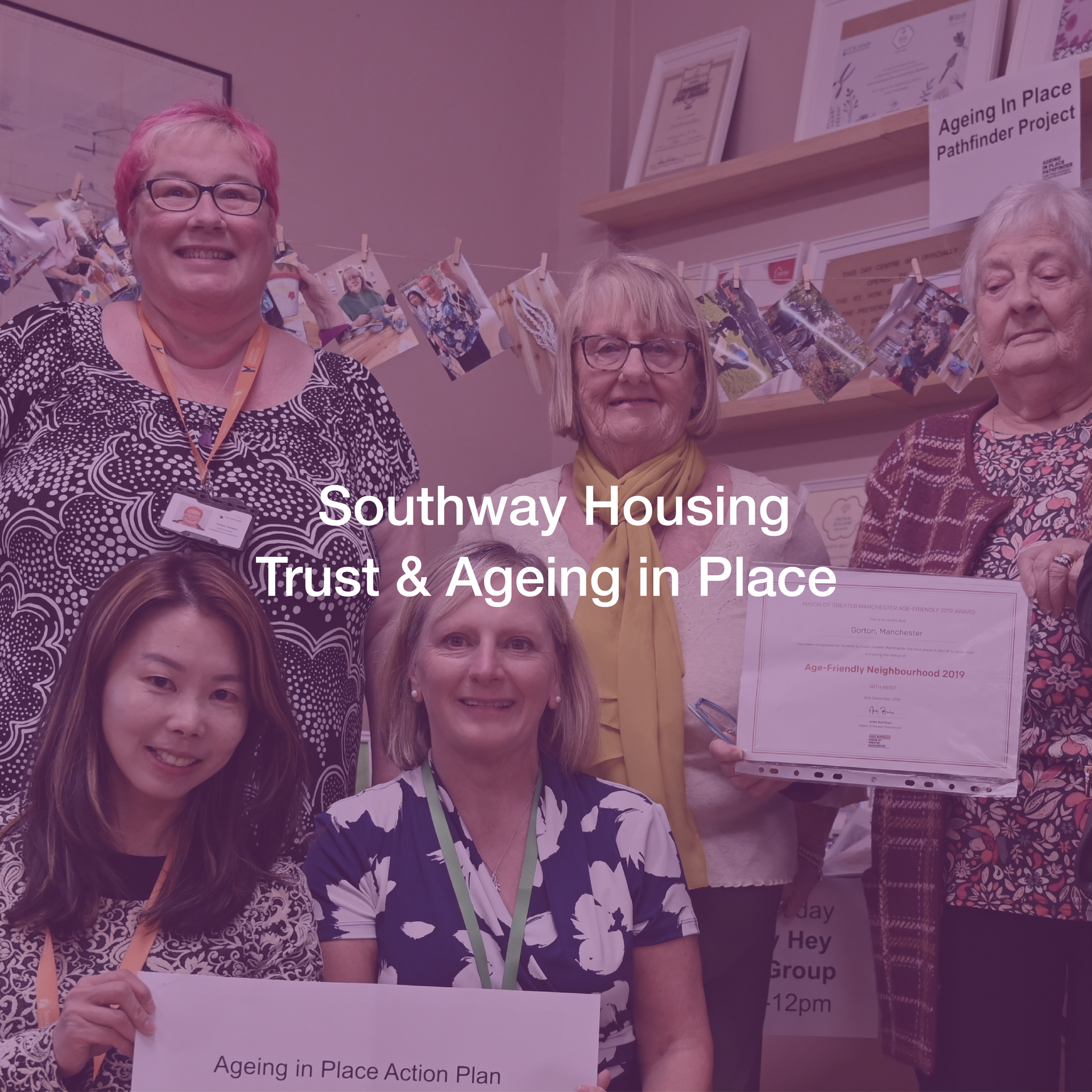 A group of women are standing next to each other holding signs.