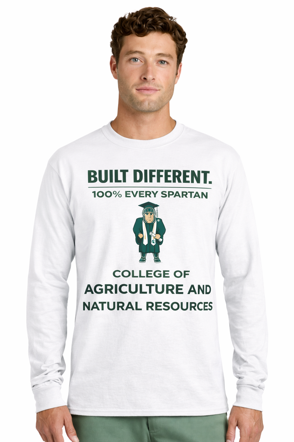 A man wears a white long-sleeve shirt with green text reading: 