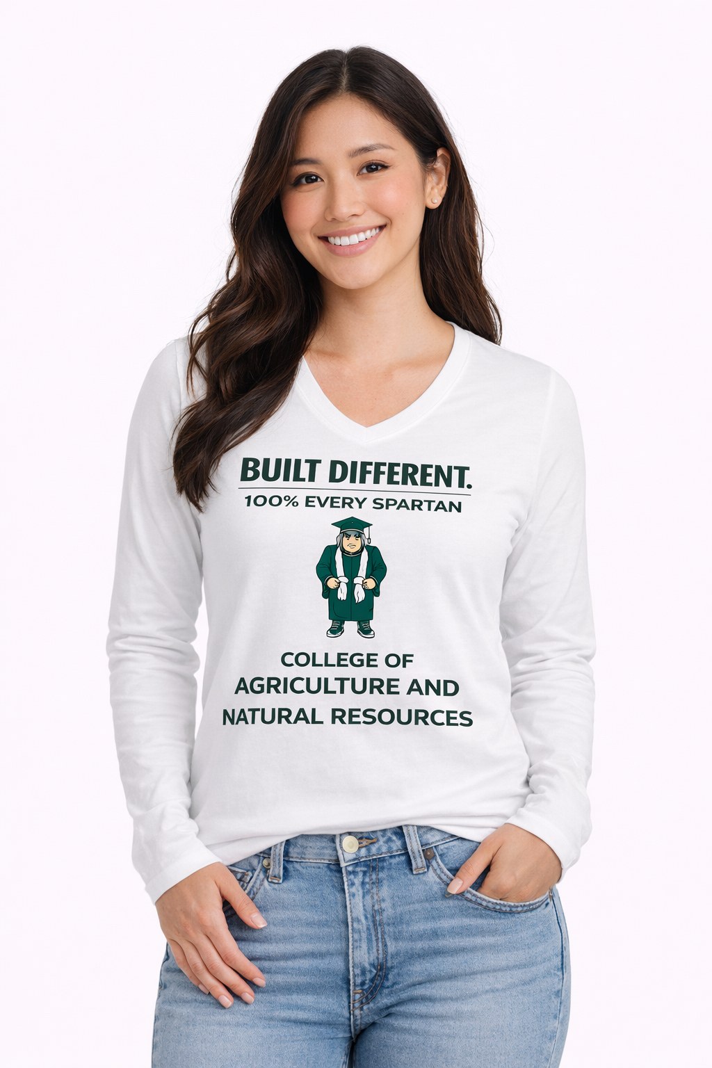 A person wearing a white long-sleeve shirt with a graphic that says 