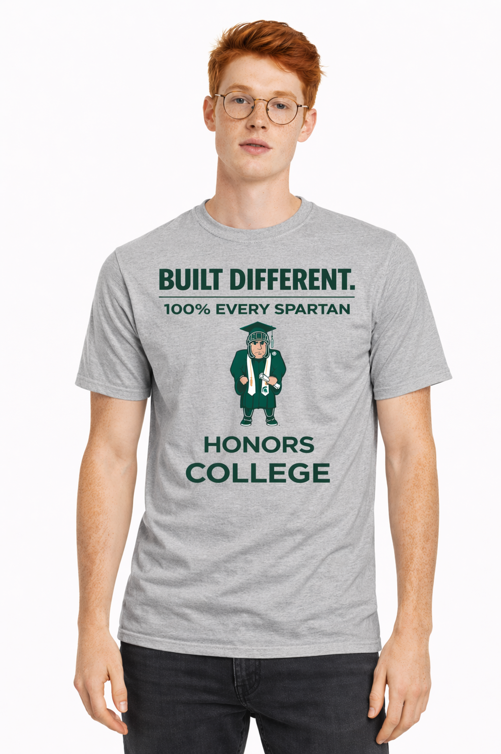 Man wearing a gray “BUILT DIFFERENT” Honors College T-shirt on a white background