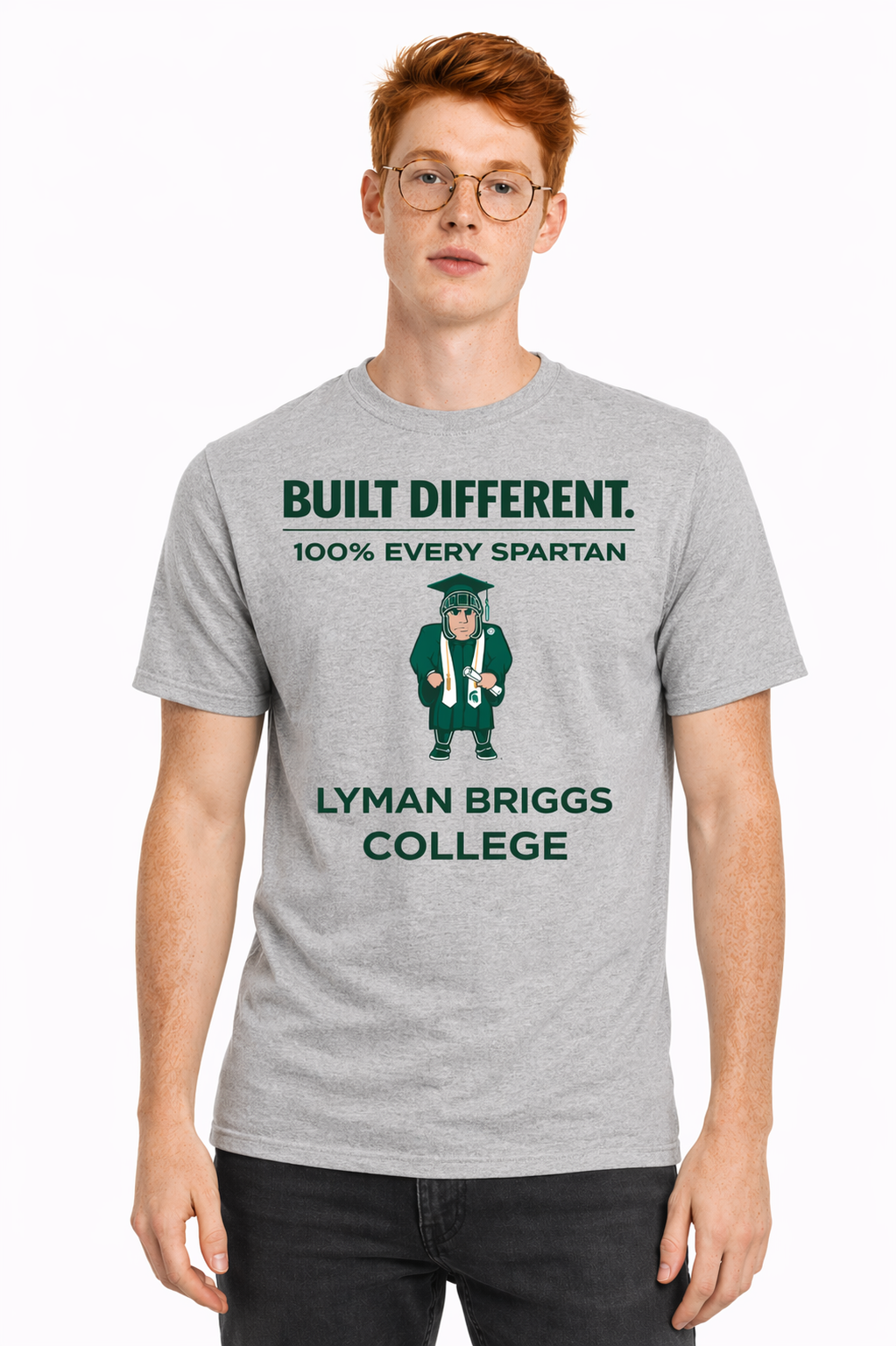 Man wearing a gray “Built Different” Lyon Briggs College T-shirt on a white background