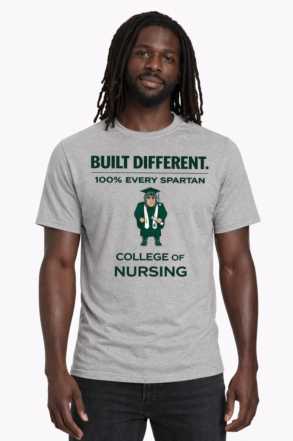 Man wearing a gray T-shirt with “BUILT DIFFERENT. 100% EVERY PARTAN. COLLEGE OF NURSING” text and graphic