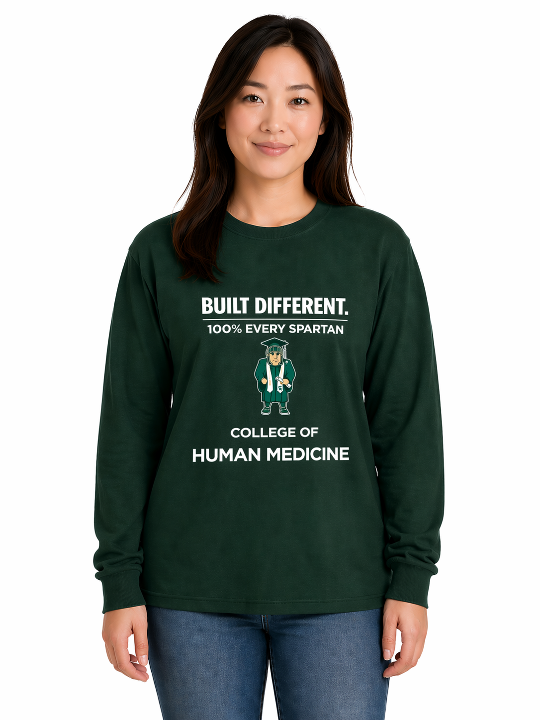 Woman wearing a green sweatshirt with “Built Different” and “College of Human Medicine” text, standing against a background