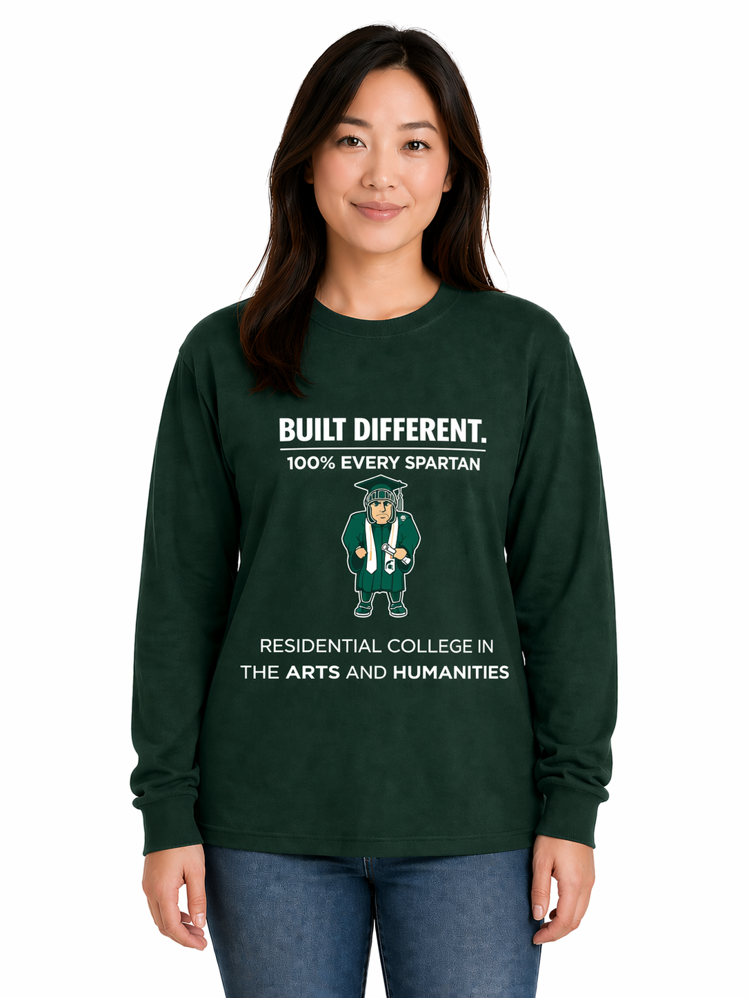 Woman wearing a dark green sweatshirt with a graphic and blue jeans on a white background