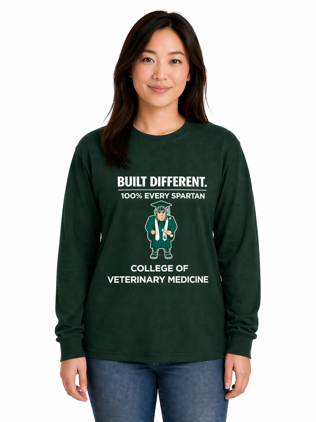 Person wearing a dark green college veterinary medicine sweatshirt and jeans, standing against a white background