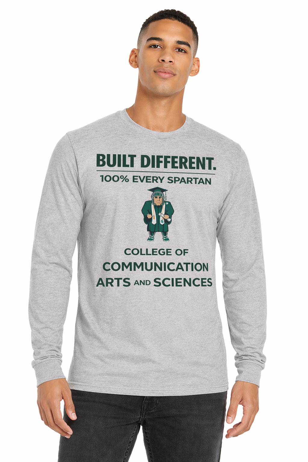 Man wearing a gray long-sleeve shirt with “Built Different” and college text printed on the front