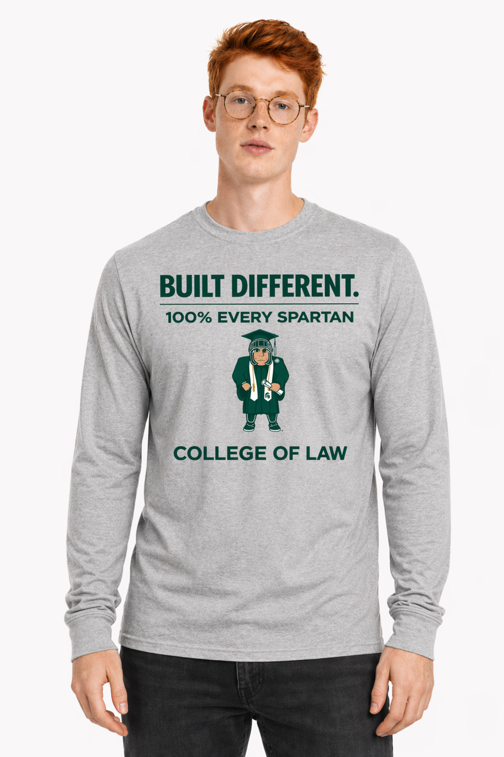 Man wearing gray sweatshirt with Spartan graphic and text “Built Different. 100% Never Been Never.”