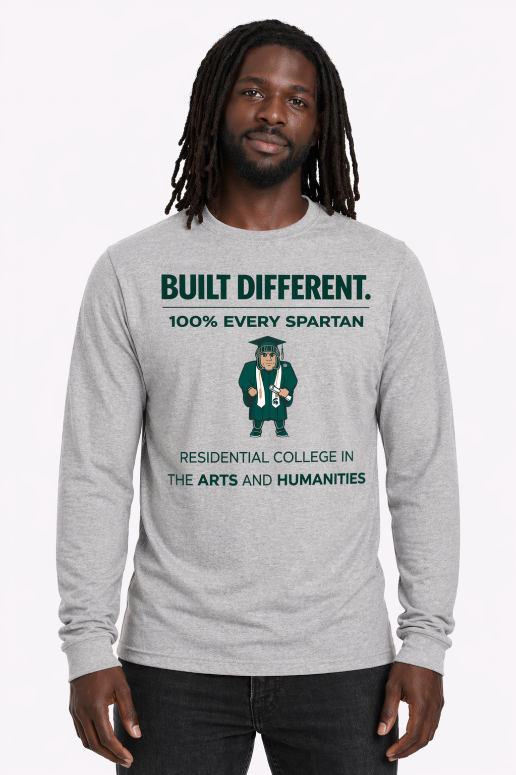 Man wearing a gray long-sleeve shirt with green text and a Spartan graphic, standing against a white background