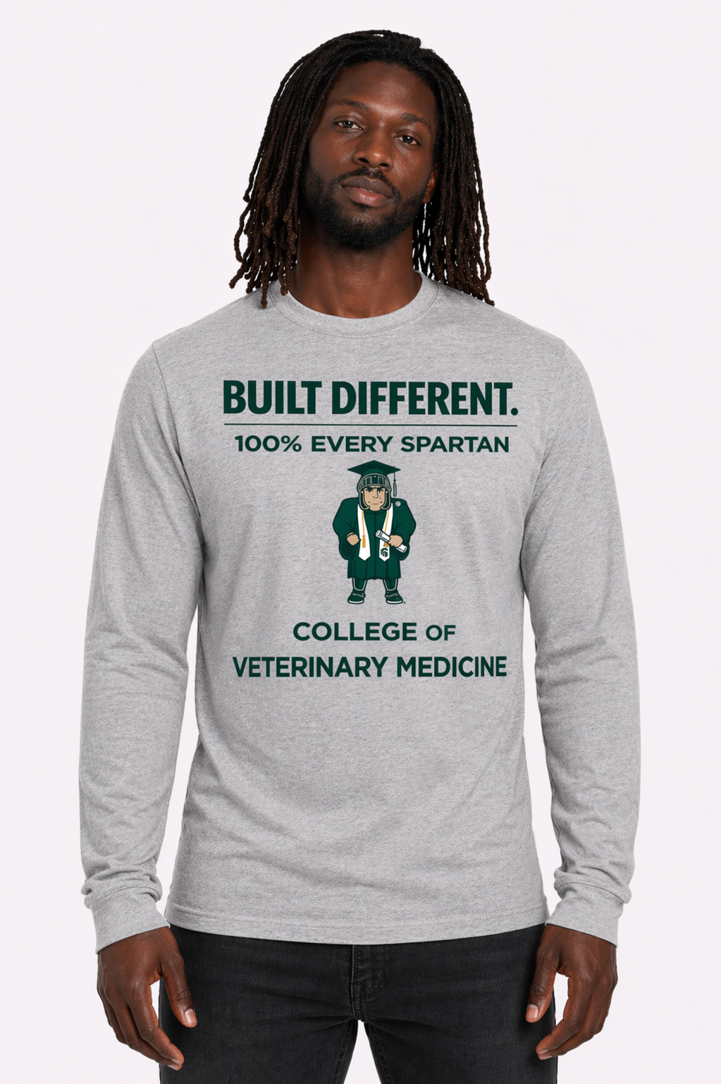 Model wearing gray sweatshirt with green “BUILT DIFFERENT” College of Veterinary Medicine graphic.