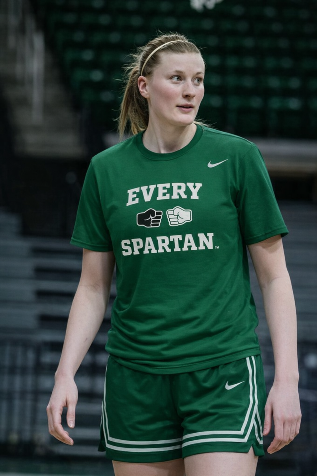 Woman in green shirt and shorts, 