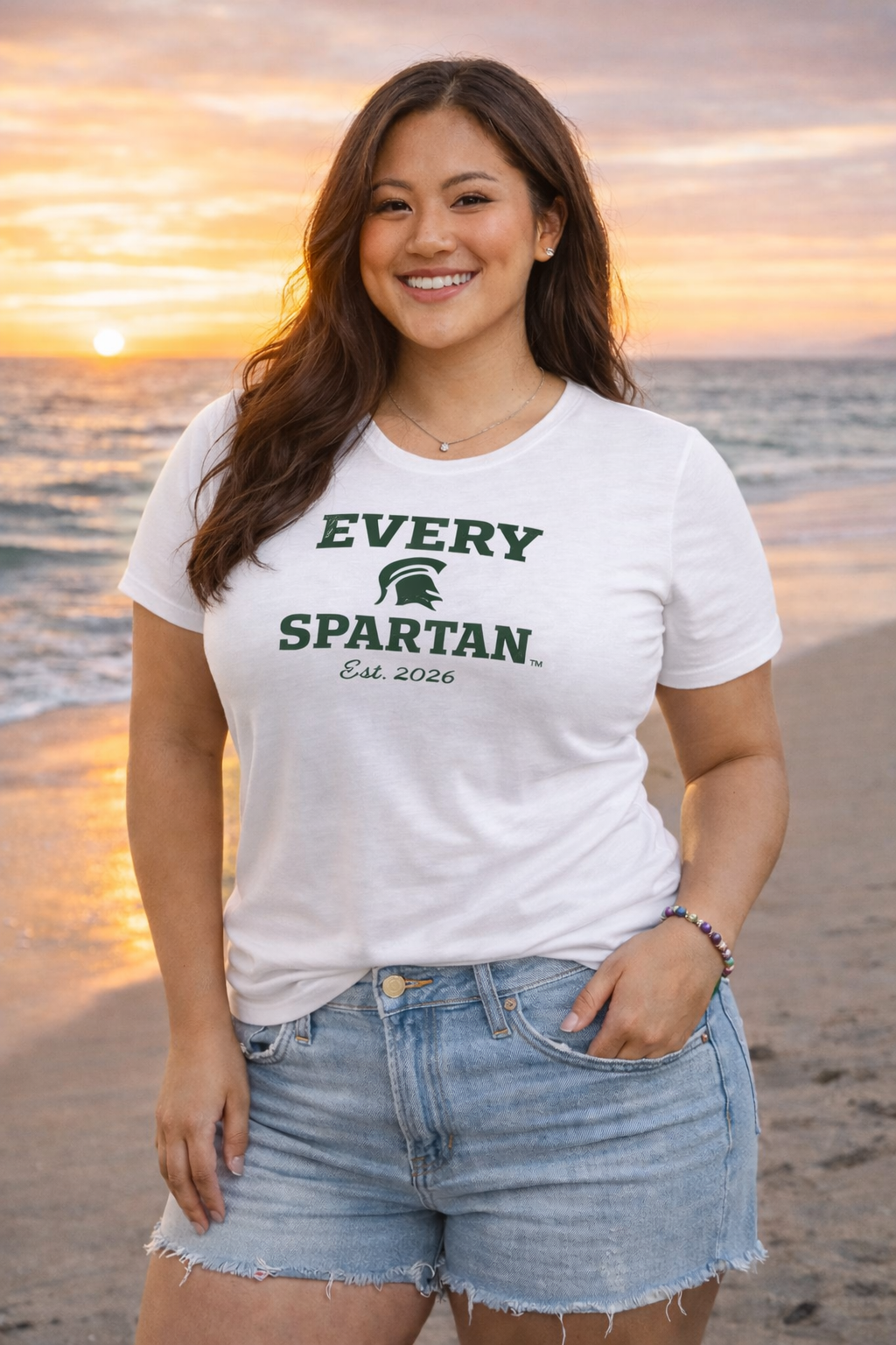 Woman smiling, wearing a white 