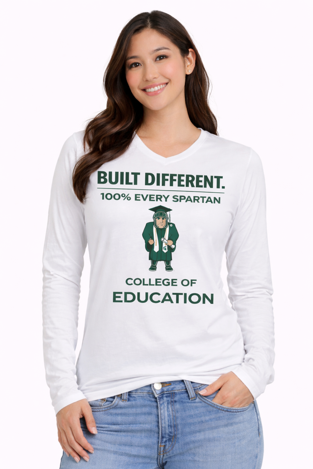 A smiling person wears a white long-sleeved shirt with 