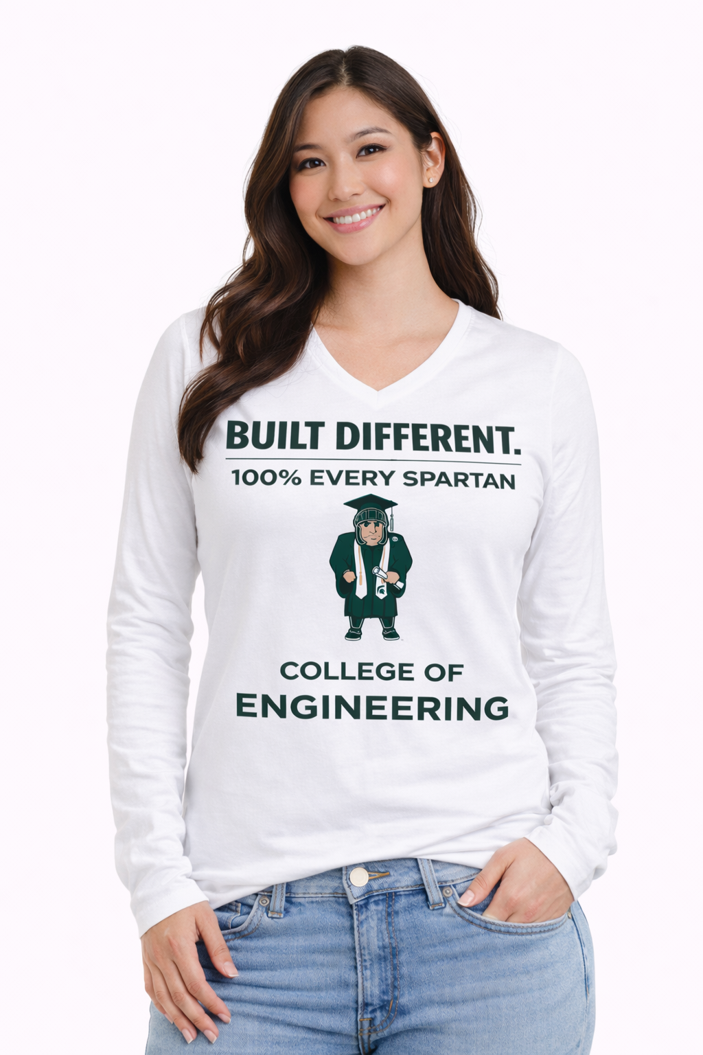 A person wearing a white long-sleeve shirt with green text and a graphic of a Spartan graduate in an engineering outfit.