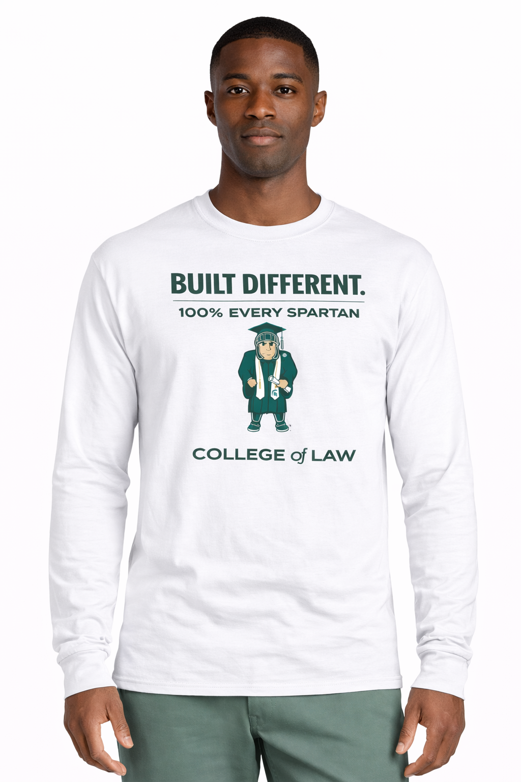 A person wears a white long-sleeve shirt with green text reading 