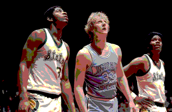 Basketball players looking up, two in green uniforms, two in blue, on court.