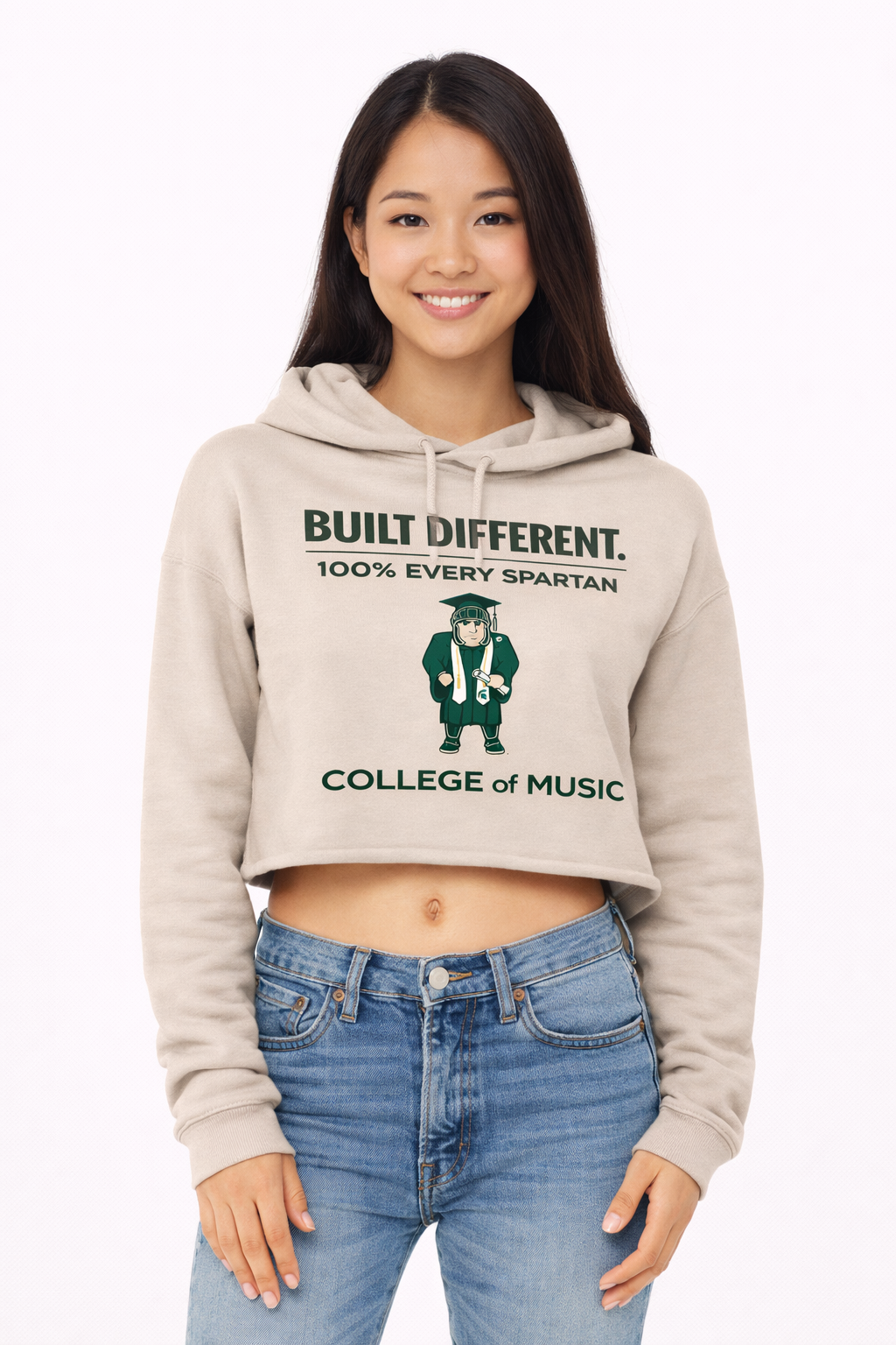 A person wears a beige cropped hoodie with 