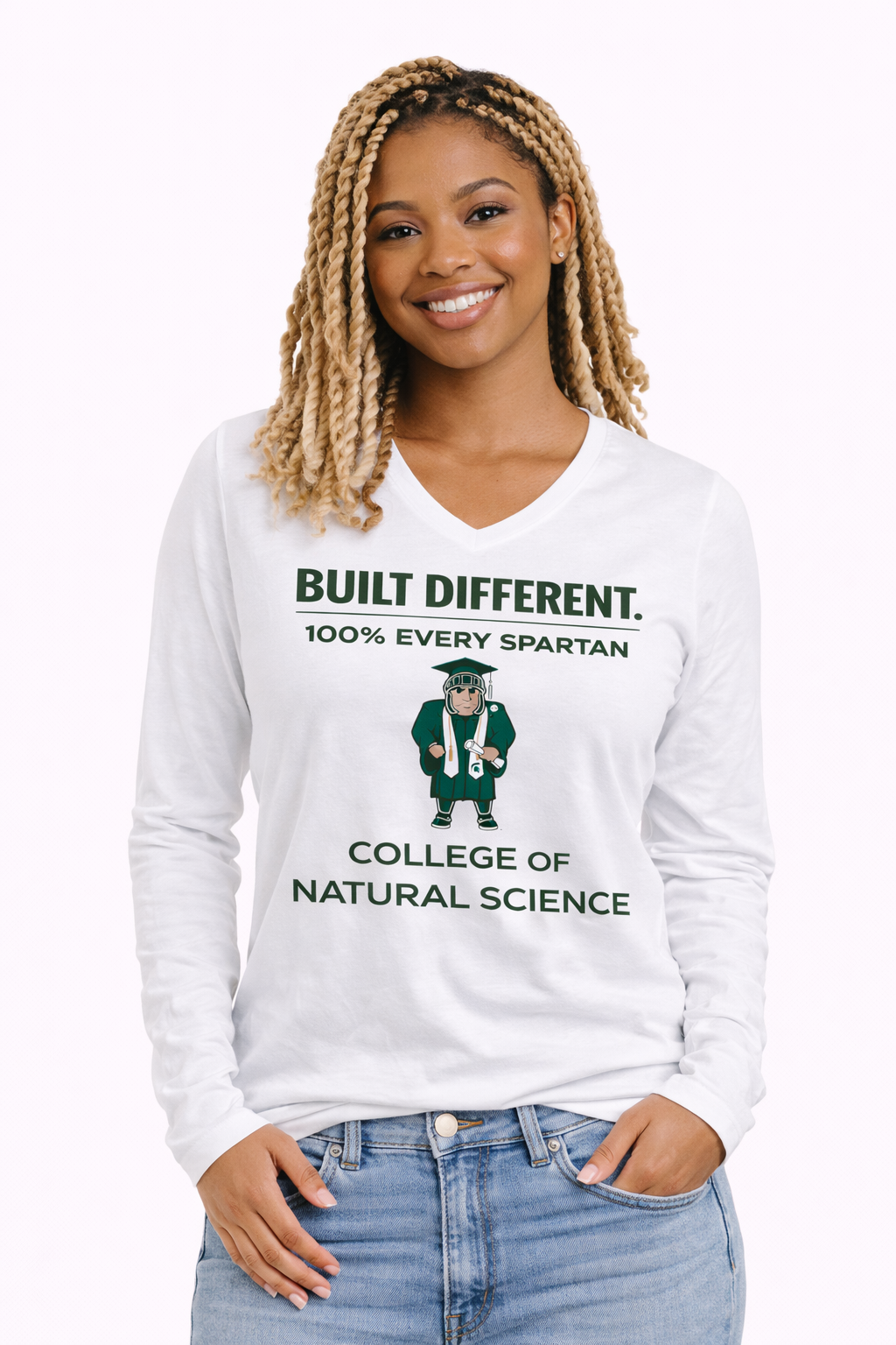 A person wearing a white long-sleeve V-neck shirt featuring a Spartan mascot and text for the College of Natural Science.