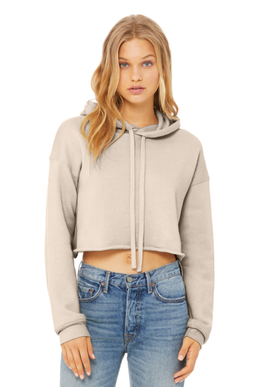 A light oatmeal-colored cropped hoodie featuring the green text 