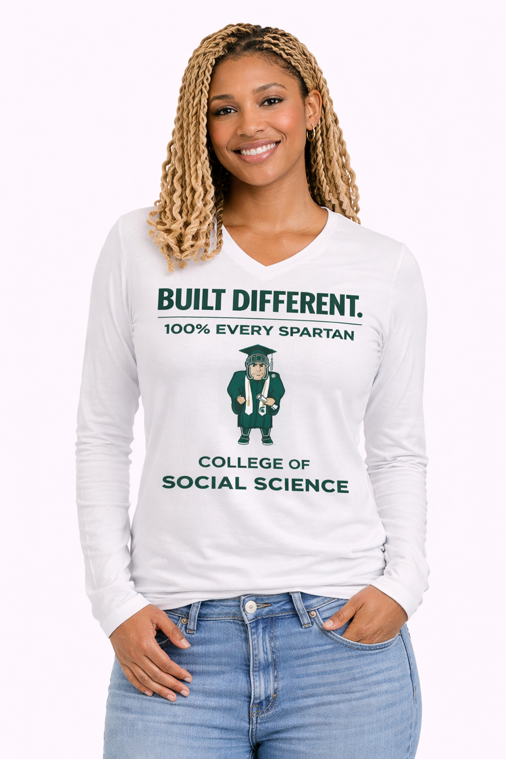 A smiling model wearing a white long-sleeve V-neck shirt that says 