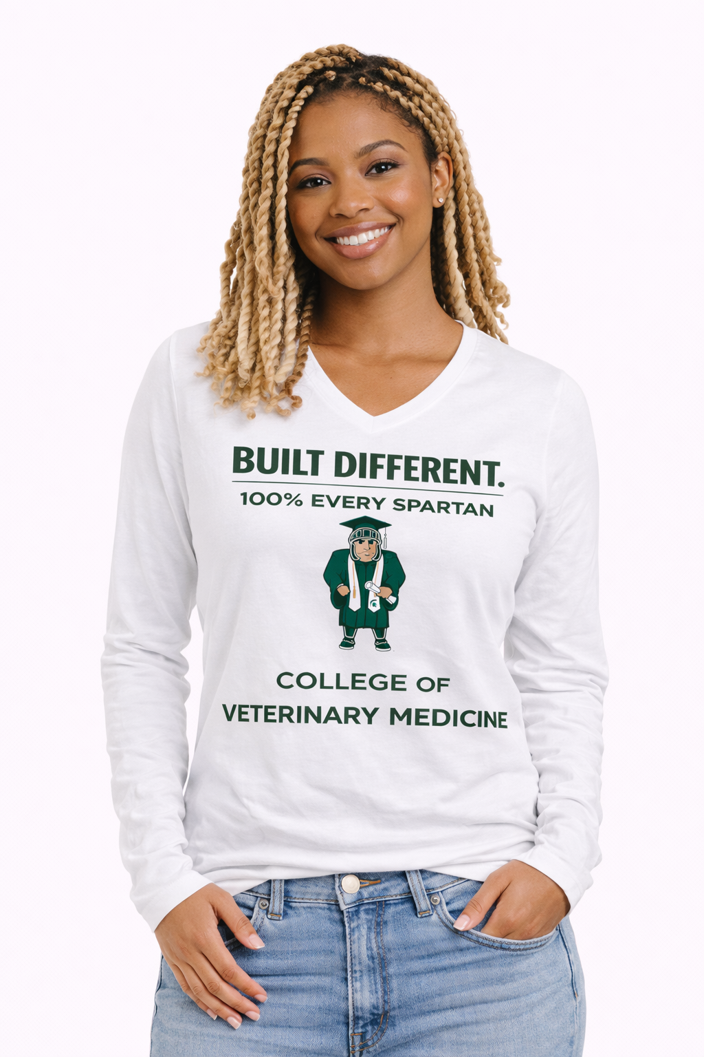 A person wears a white V-neck long-sleeve shirt with green text reading 