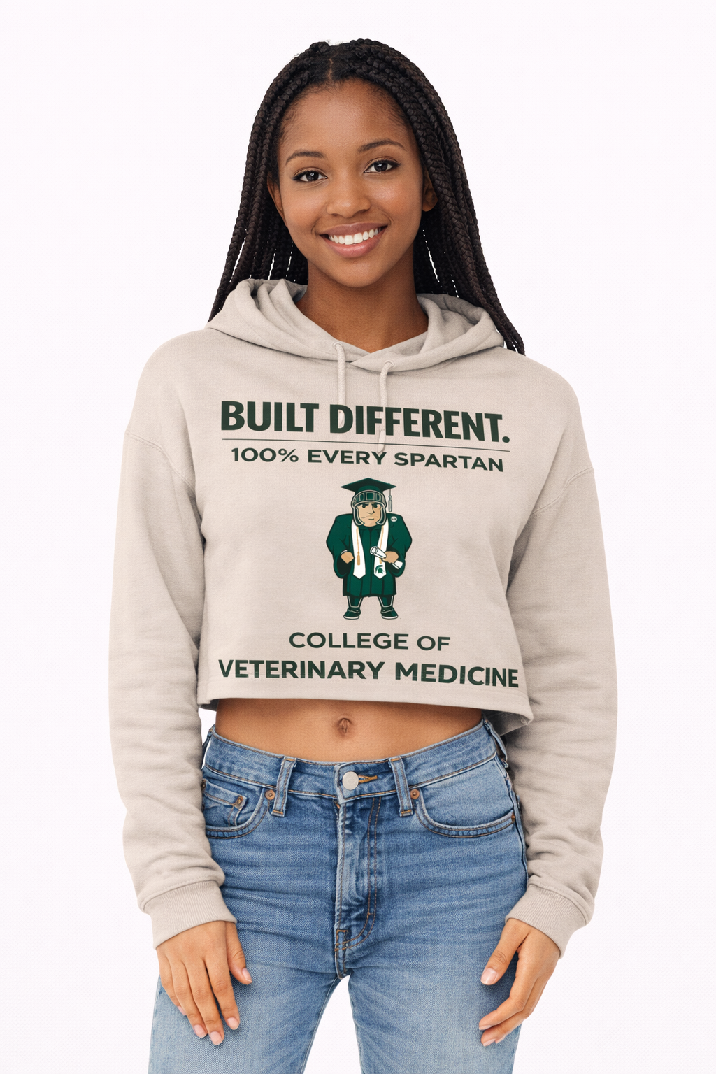 A person wears a beige cropped hoodie with 