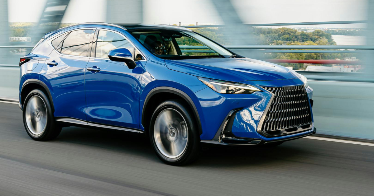 Blue Lexus NX SUV driving on a bridge.