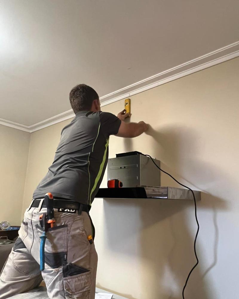 Worker Getting Measurements — Electrical Services In Corowa, NSW