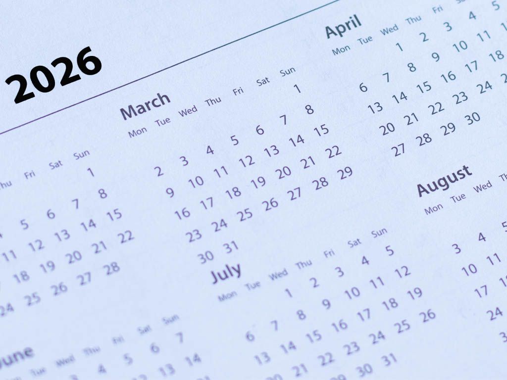 Close-up of a 2026 calendar, showing months like March, April, July, and August.