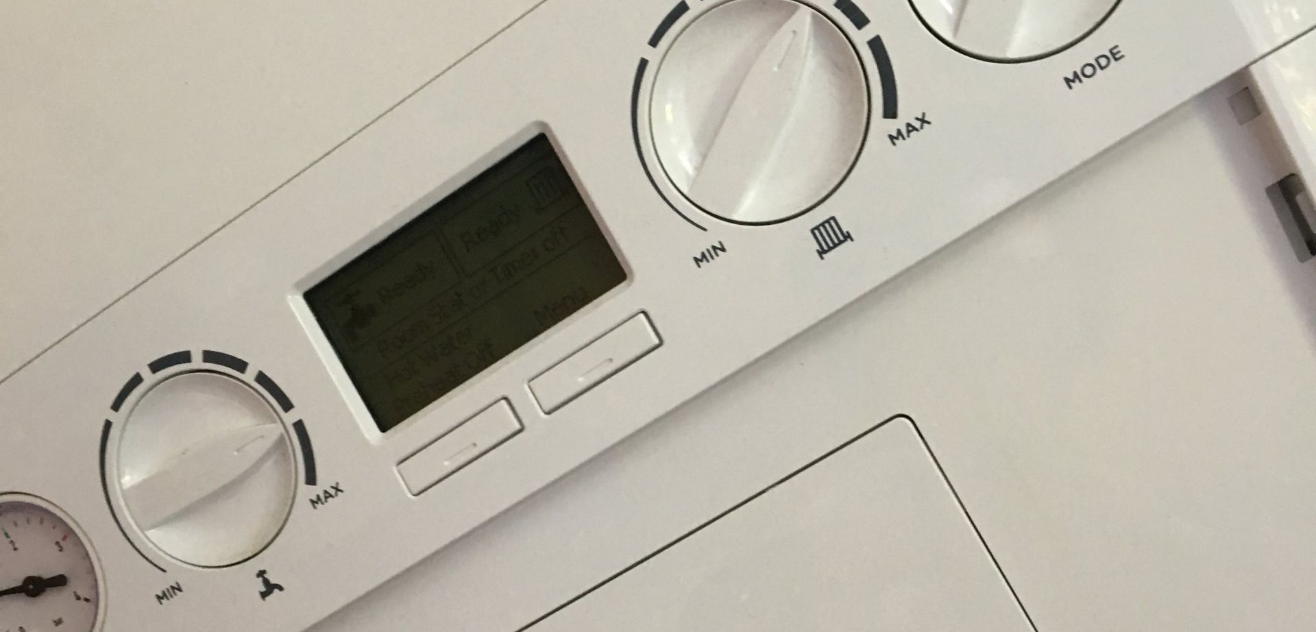 White control panel with dials, display screen, and buttons.