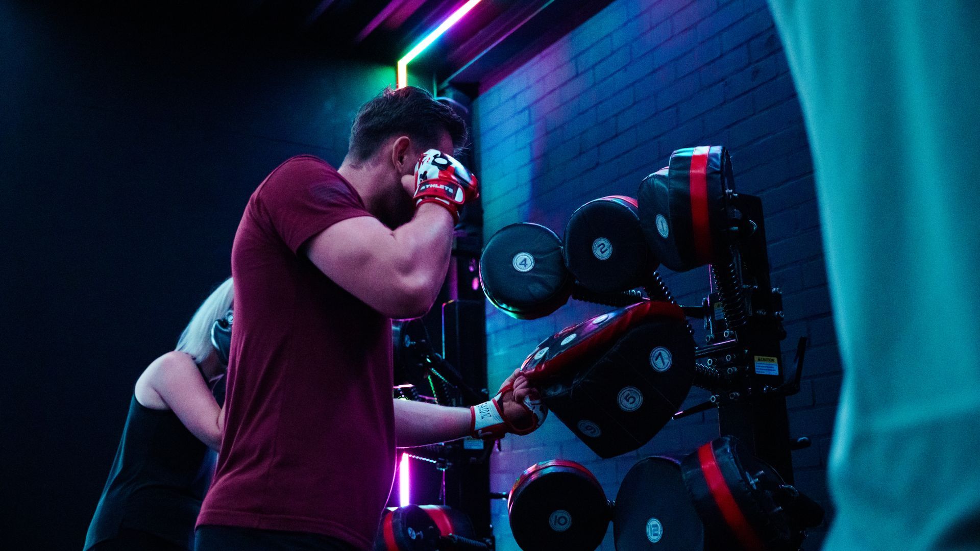 Team collaborating over design sketches at a bright office table with papers and tools spread out