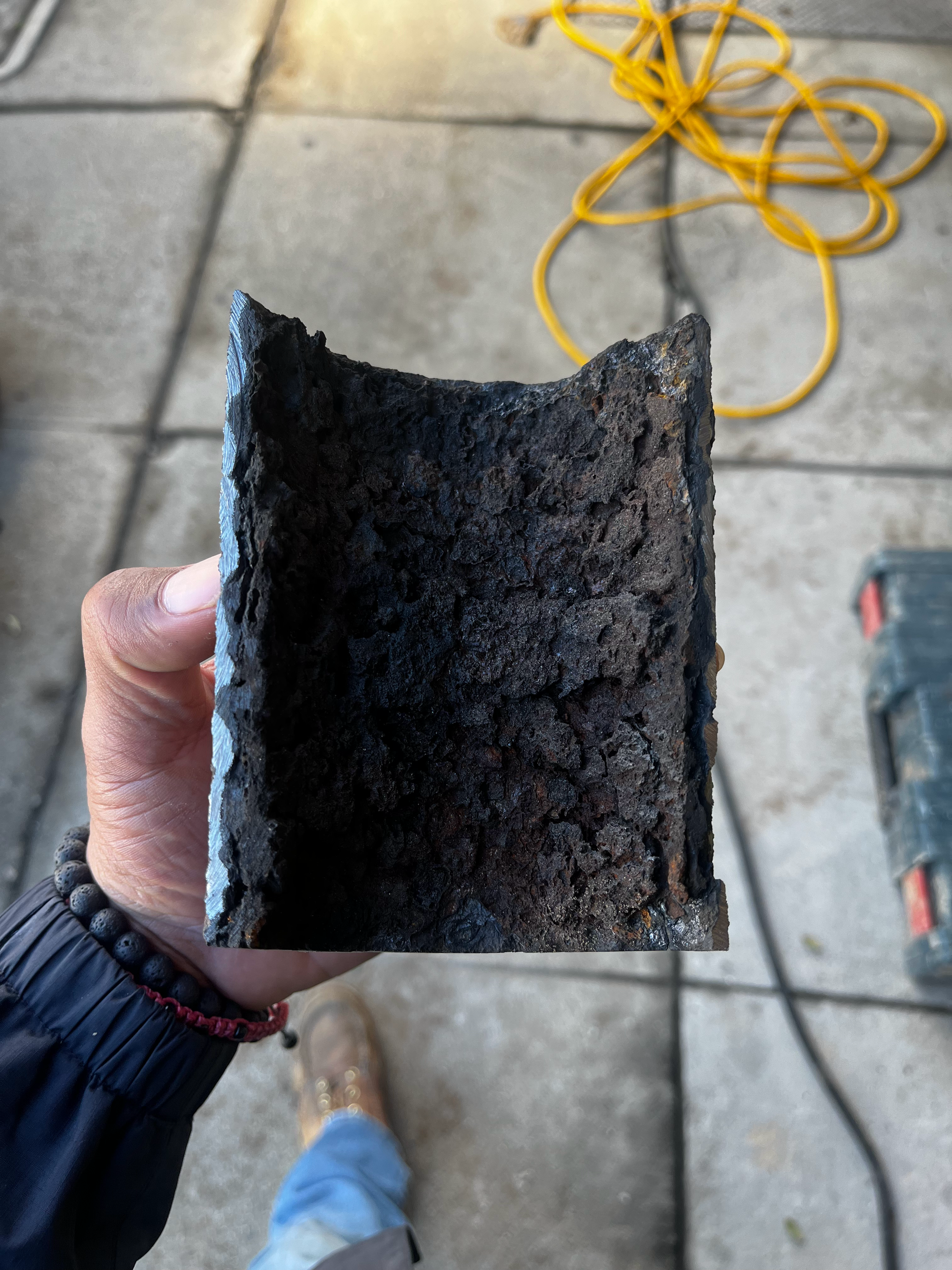 A Person Is Holding a Piece of Concrete in Their Hand — Granada Hills, CA  — Future Plumbing