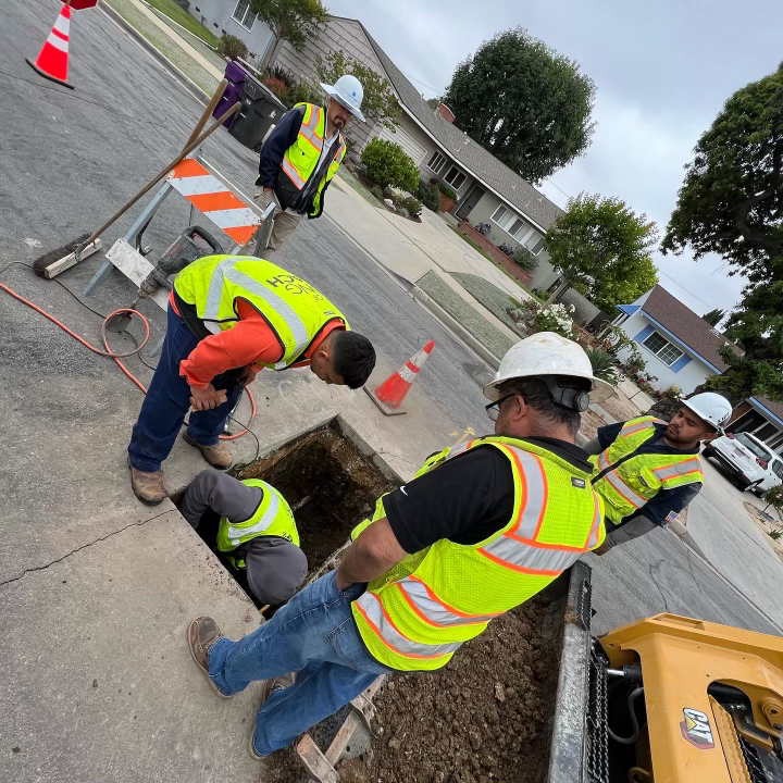 A Group of Construction Workers Are Working on a Street — Granada Hills, CA  — Future Plumbing