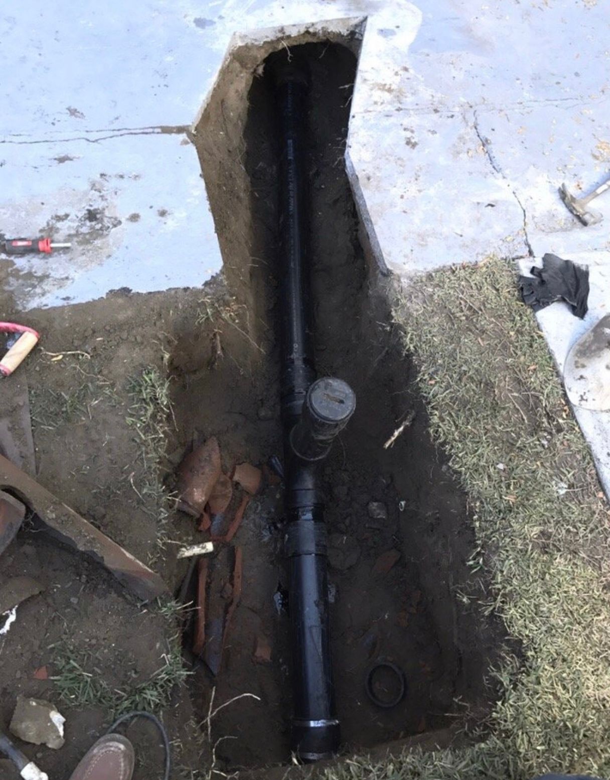A Black Pipe Is Being Installed in the Ground — Granada Hills, CA  — Future Plumbing